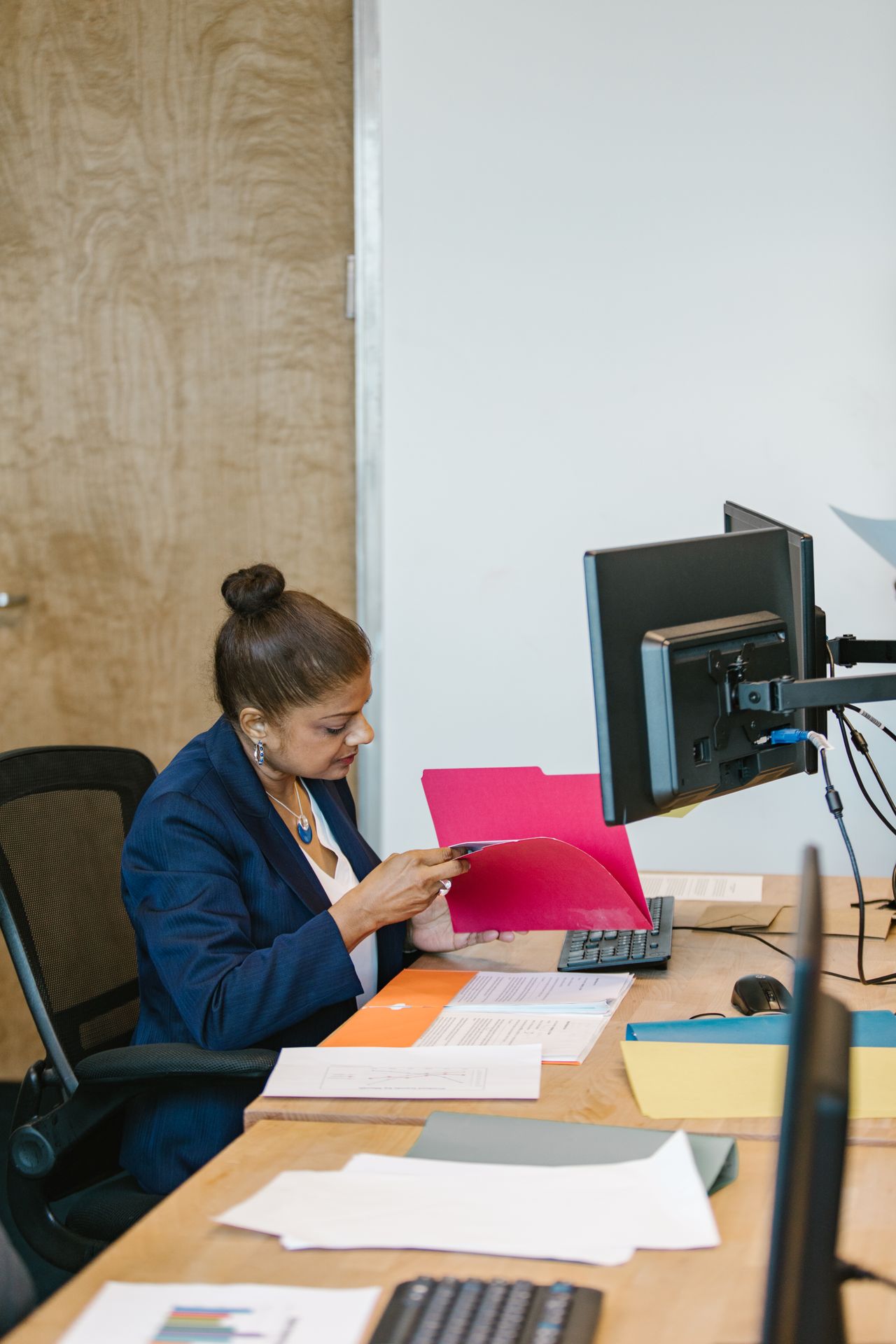 Folders and documents at a computer workstation