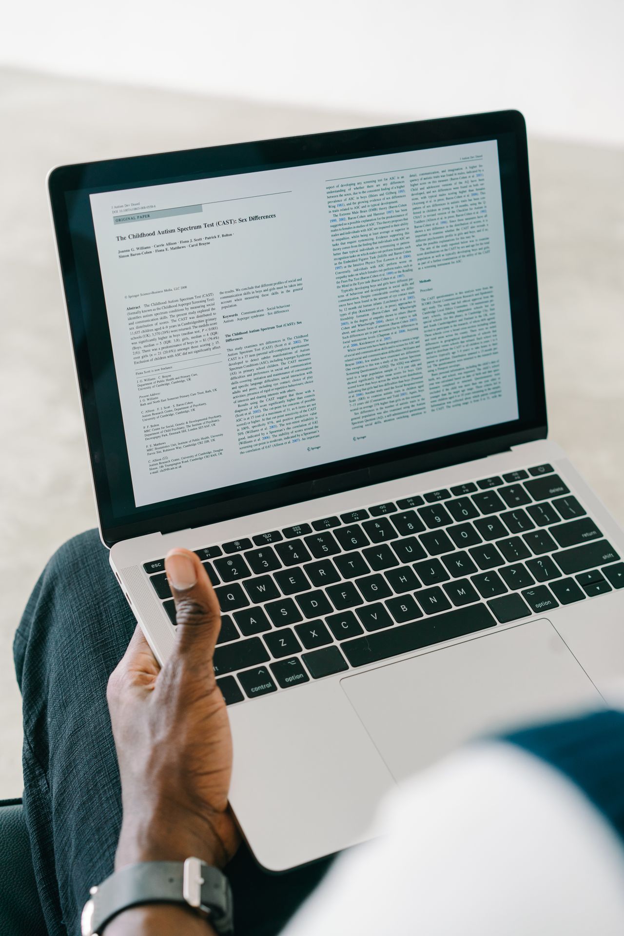 A document displayed on an open laptop