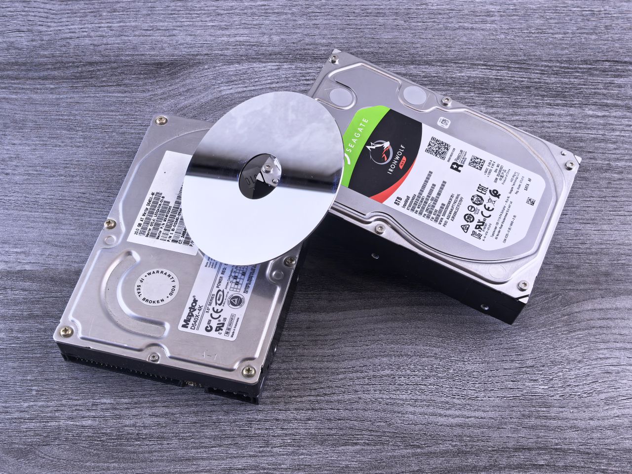 Several storage devices on a wooden table