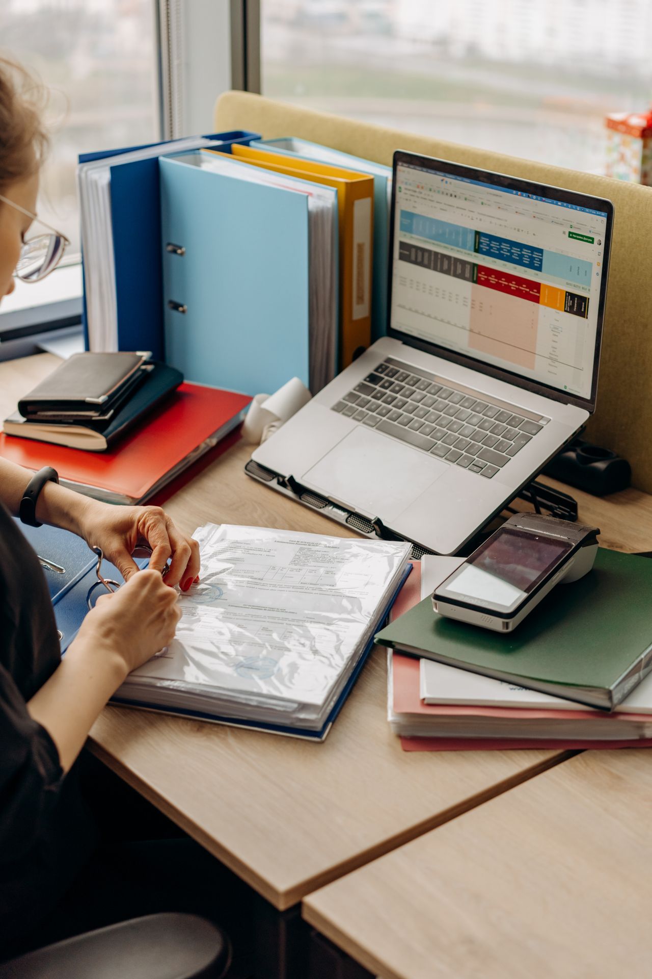 Documents being filed in a binder
