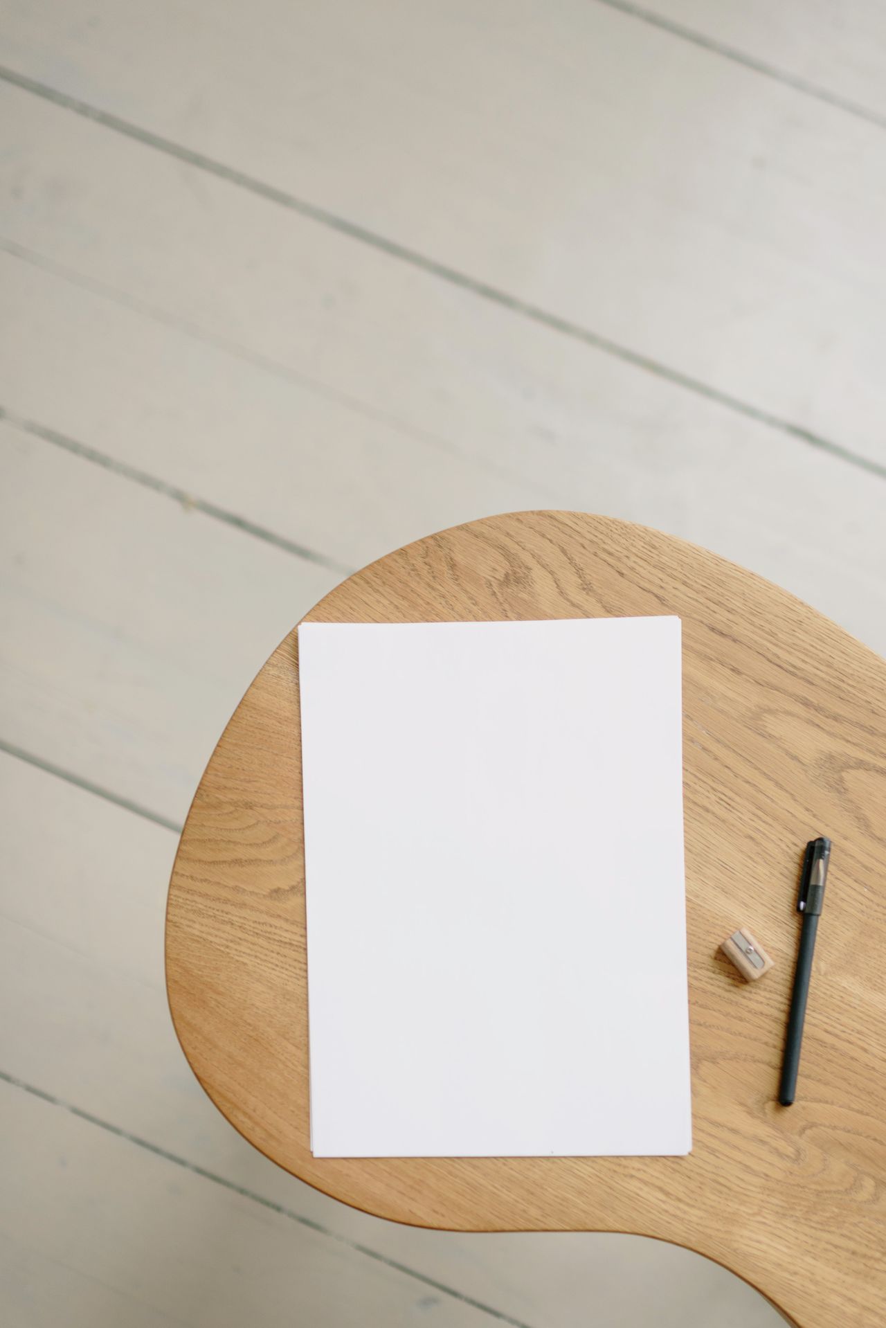 Paper and pen on a clear work surface