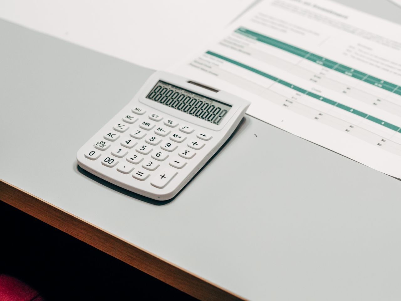 Calculator beside a table of numbers