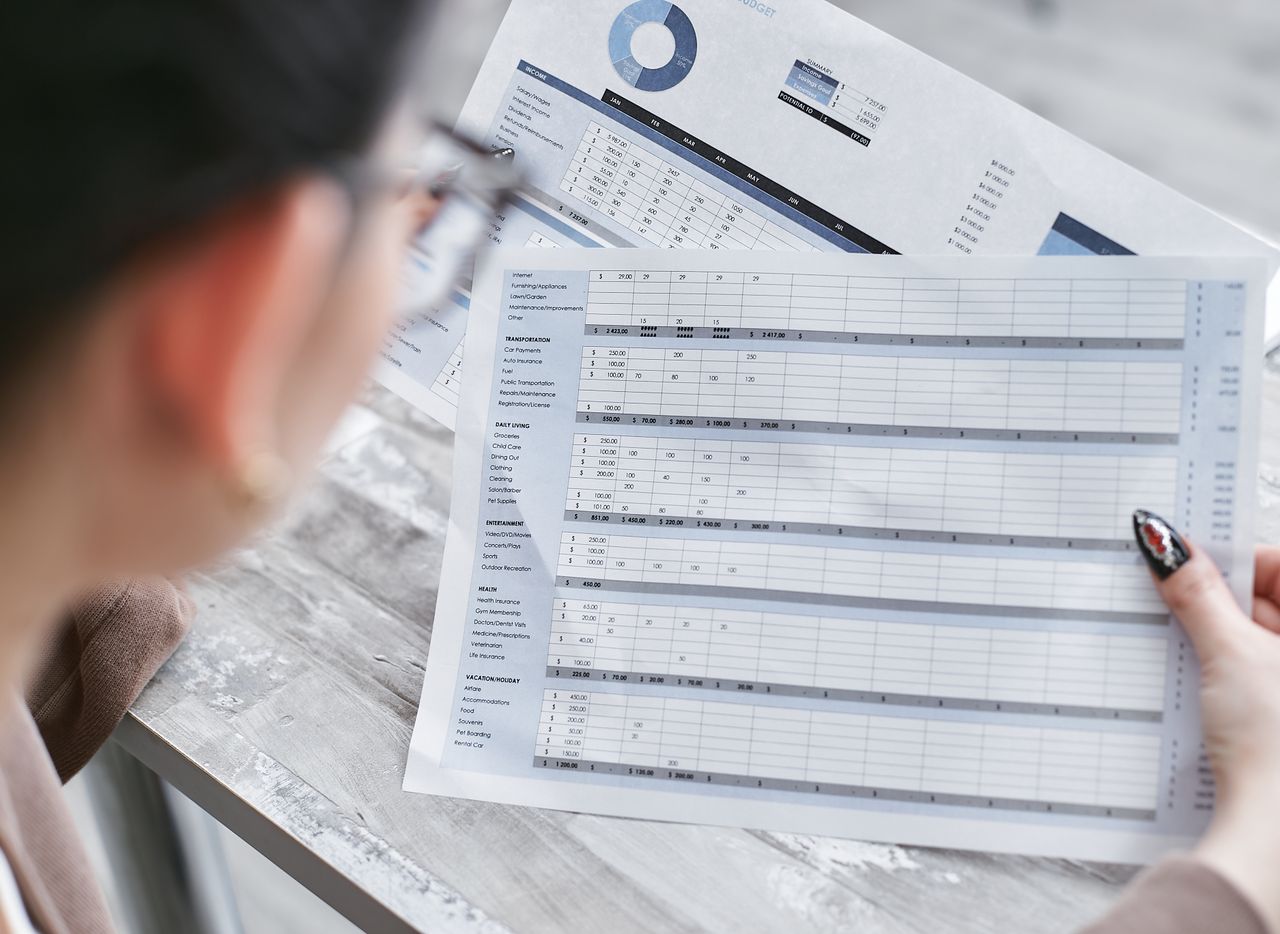 Printed tables and charts being reviewed