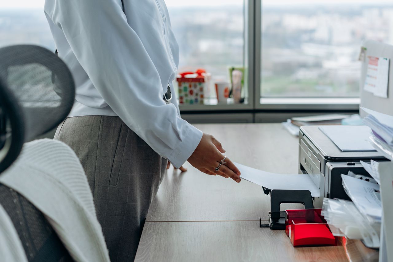 A document being produced by a printer