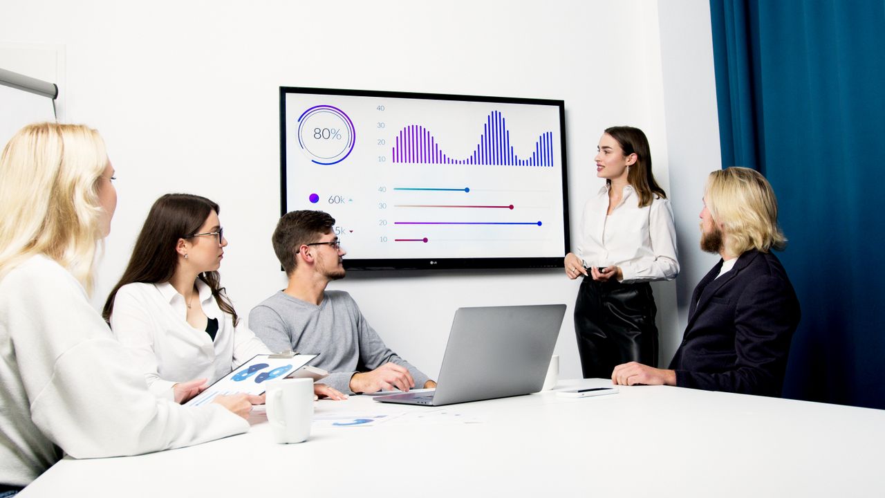 Meeting with charts on a screen