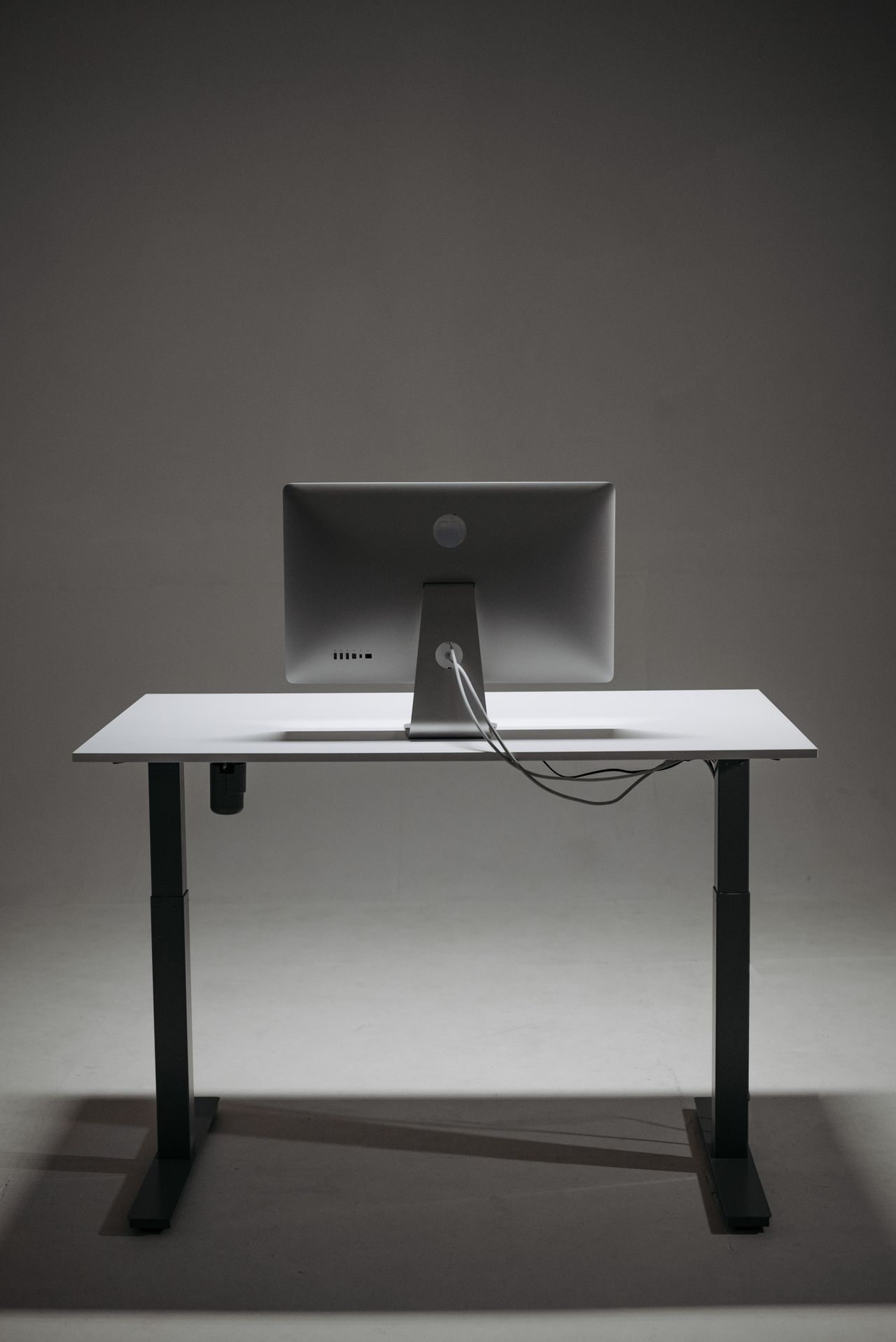 Monitor on a height-adjustable desk