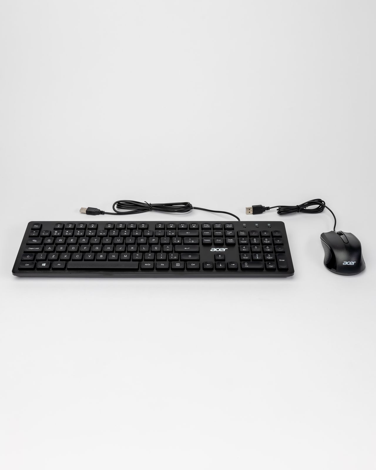 Wired keyboard and mouse on a light background