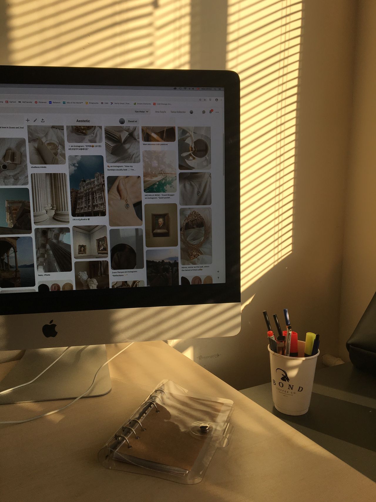 Sunlight through blinds on a computer workstation