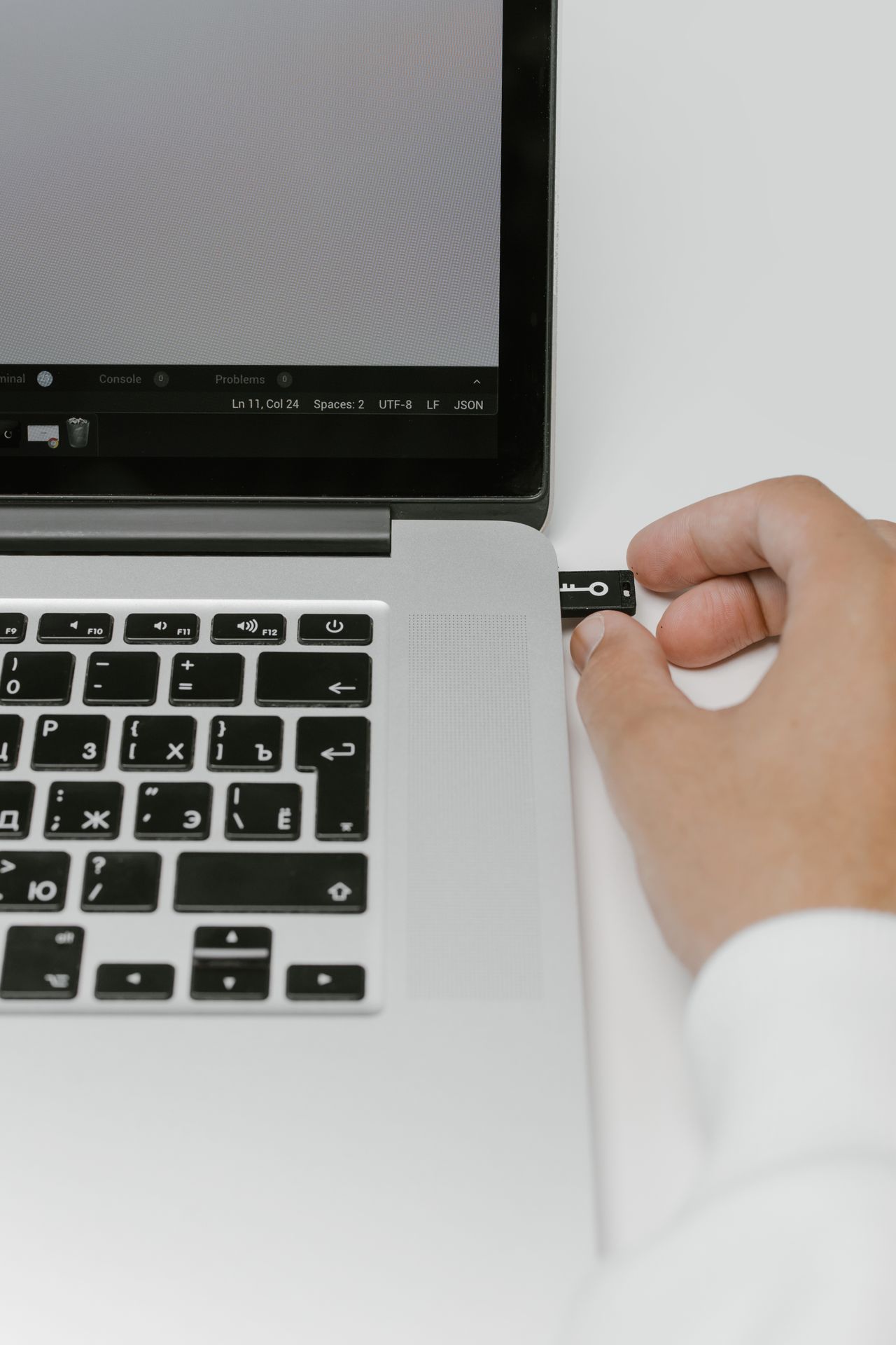 A USB device being connected to a laptop